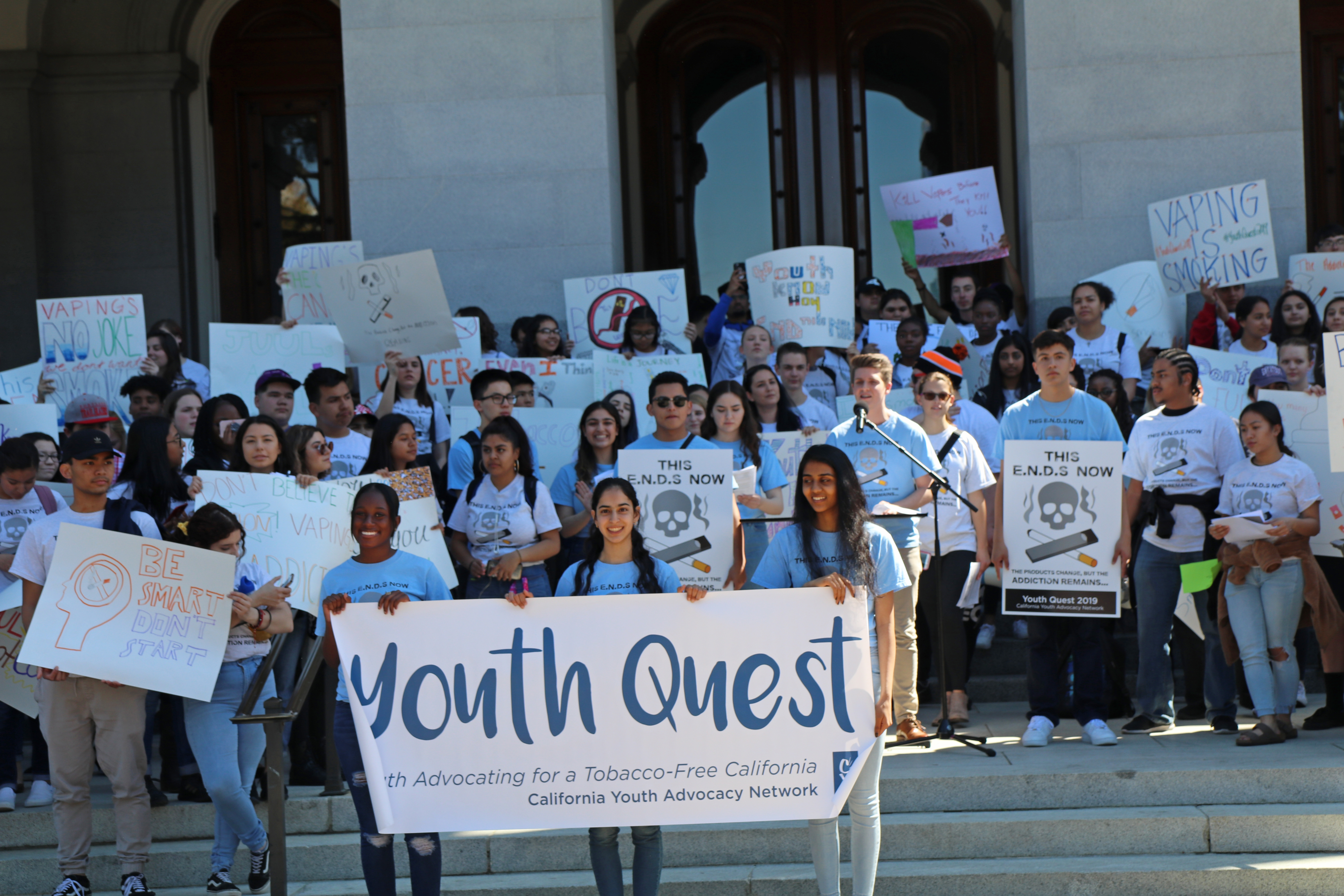 Youths of Youth Quest standing in front of the California Capitol displaying Anti-Tobacco Banners