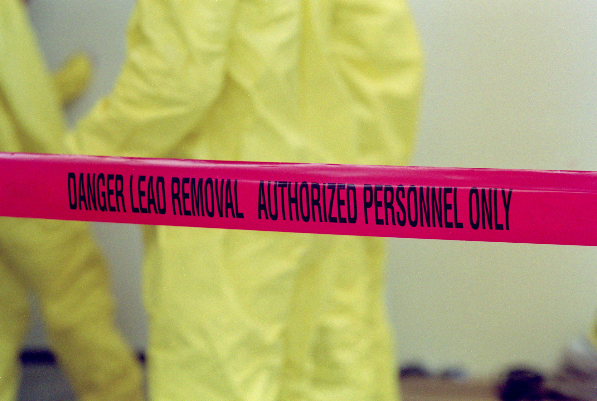 Caution tape reading danger lead removal