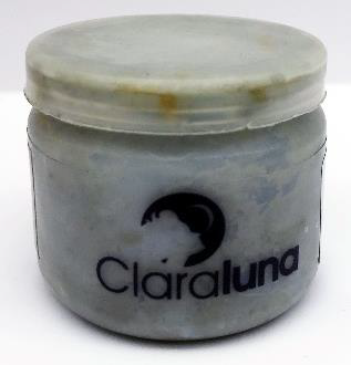 small round opaque container of blue-ish face cream with black lettering that says "ClaraLuna"