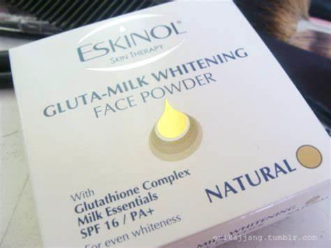 A box of face powder that says in blue lettering "eskinol: gluta-milk whitening face powder