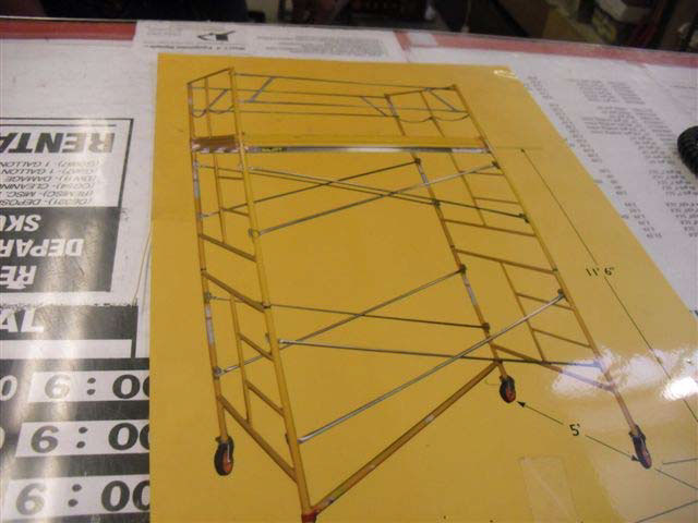 The type of scaffold involved with wheeled vertical support poles and diagonal cross support poles.