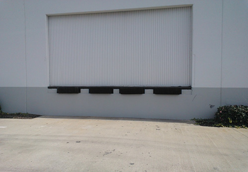 A truck loading dock similar to the one in the incident, showing the ledge several feet off the ground.