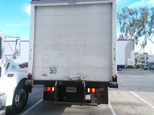 The rear of a large cargo box truck similar to the one in the incident