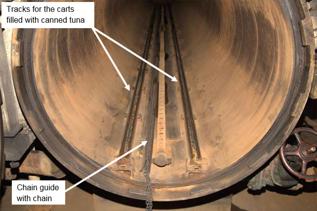 The inside of the retort showing the cart tracks and the chain guide