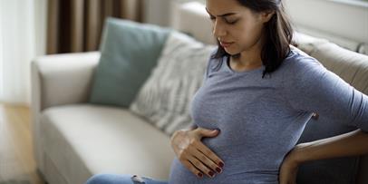 pregnant individual in pain