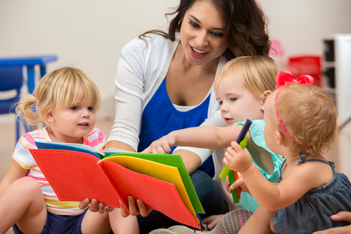 Child are provider reading to infants and toddlers age 12 months to 2 years