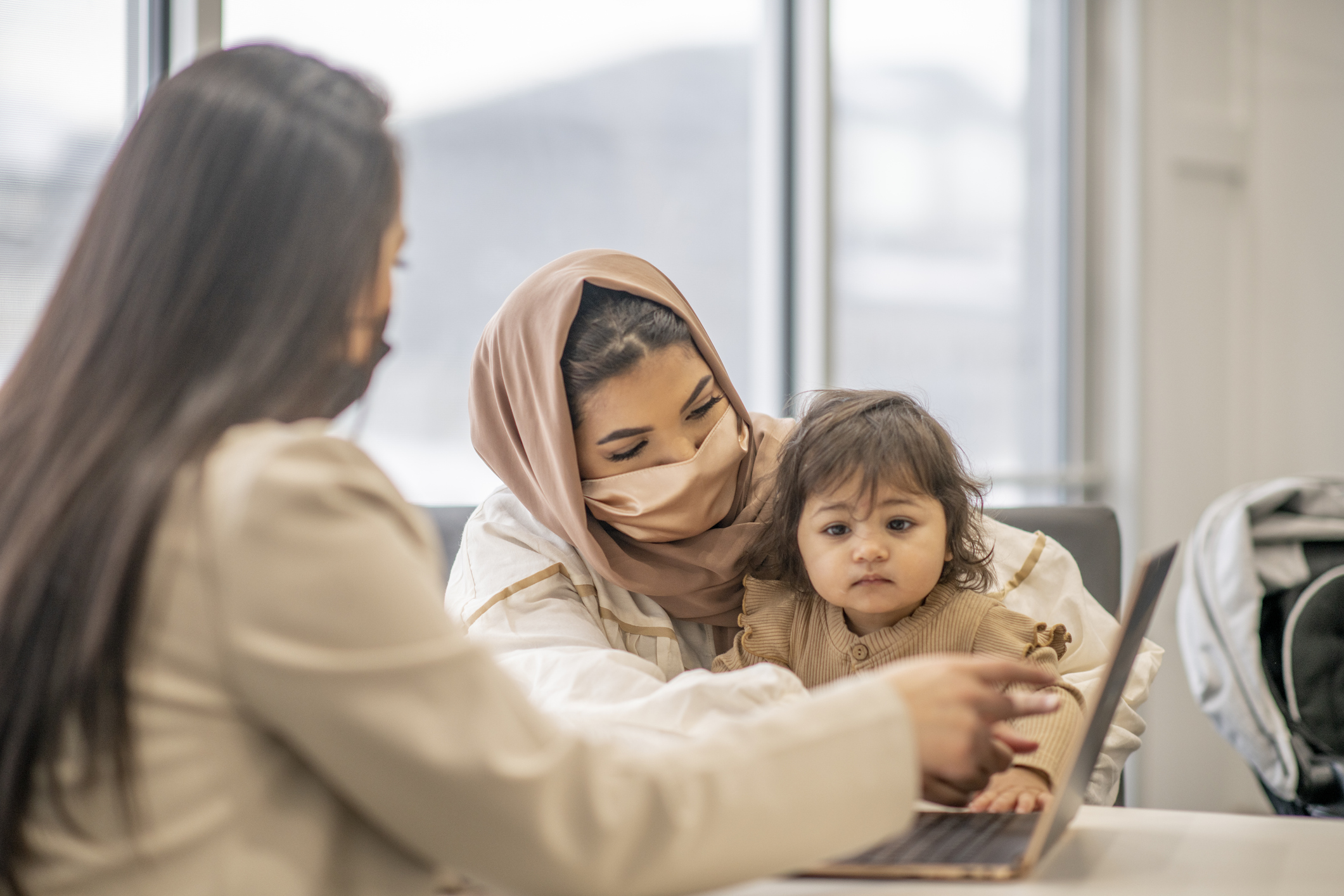 Baby and mom receiving health screening