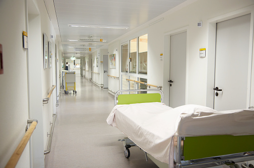 Hospital hallway with hospital bed