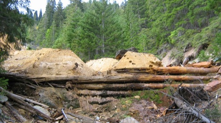 An area in Blue Ledge Mine site with mounds of contaminated waste rock and soil An area in Blue Ledge Mine site with mounds of contaminated waste rock and soil