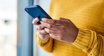 Person Holding Mobile Phone